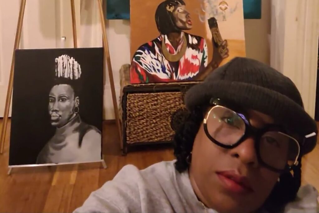 artist with paintings
